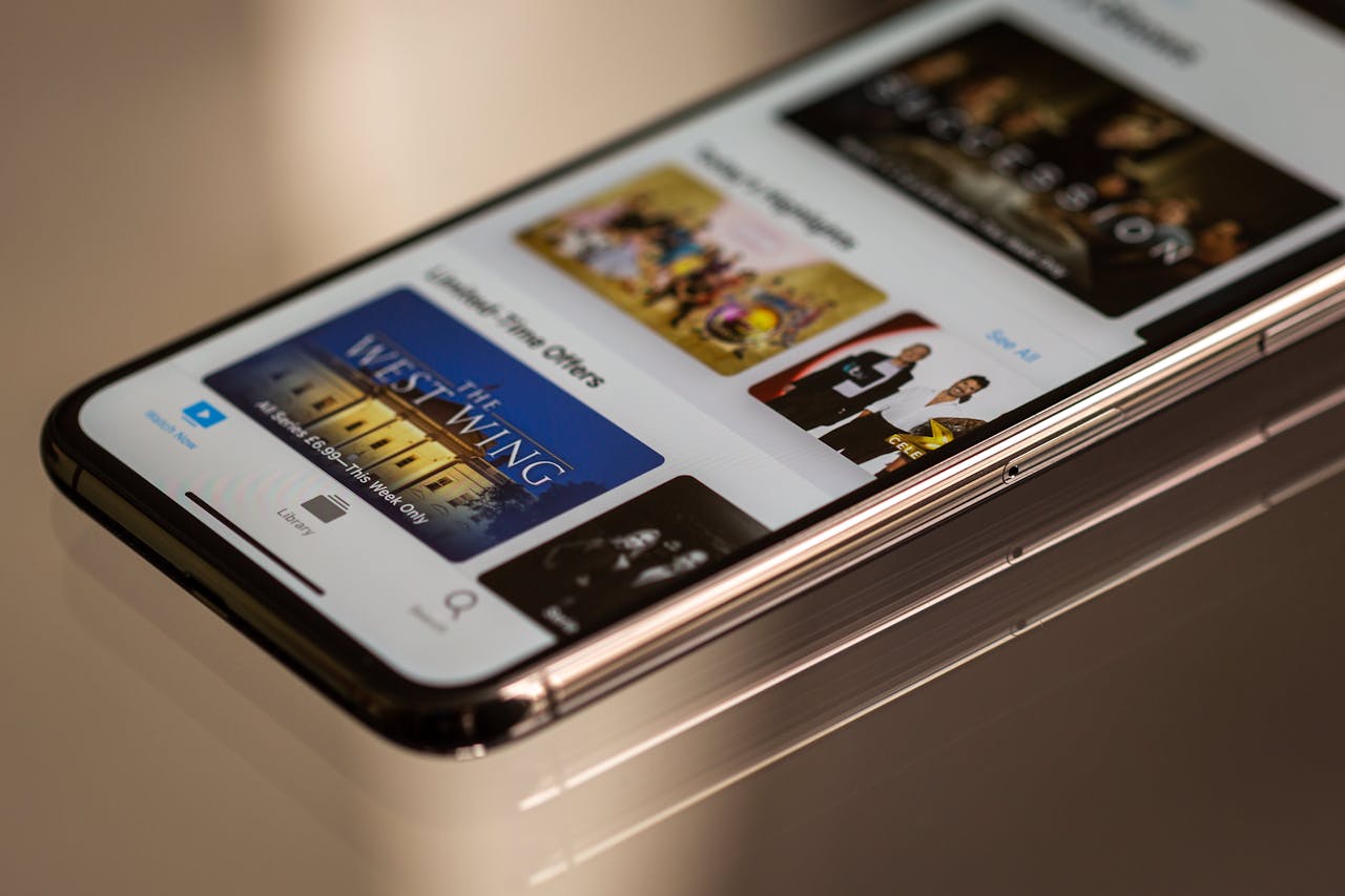 Home Close-up view of a smartphone featuring a streaming service interface, highlighting technology in modern entertainment.